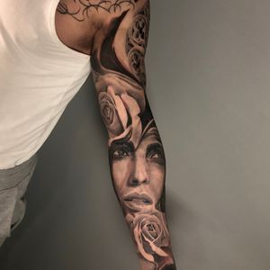Black and grey realistic woman portrait surrounded by roses full sleeve tattoo, London, UK | #realistictattoos #blackandgreytattoos #fullsleevetattoos #rosestattoos #portraittattoos 