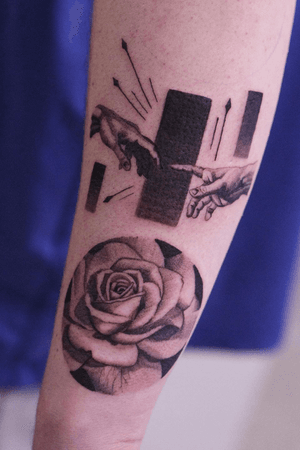 Touching hand and rose tattoo