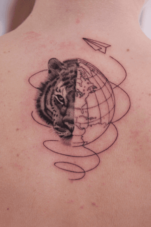 Tiger and a globe tattoo