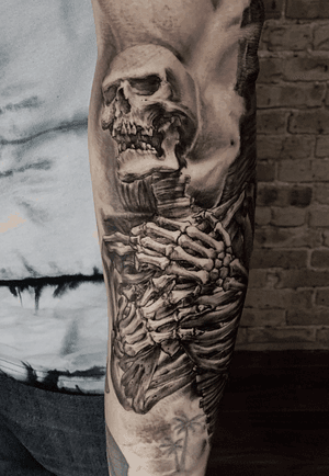 Black and gray skeleton tattoo