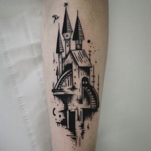 Vibrant new school tattoo on forearm by Jonathan Glick, featuring a whimsical castle with enchanting stairs.