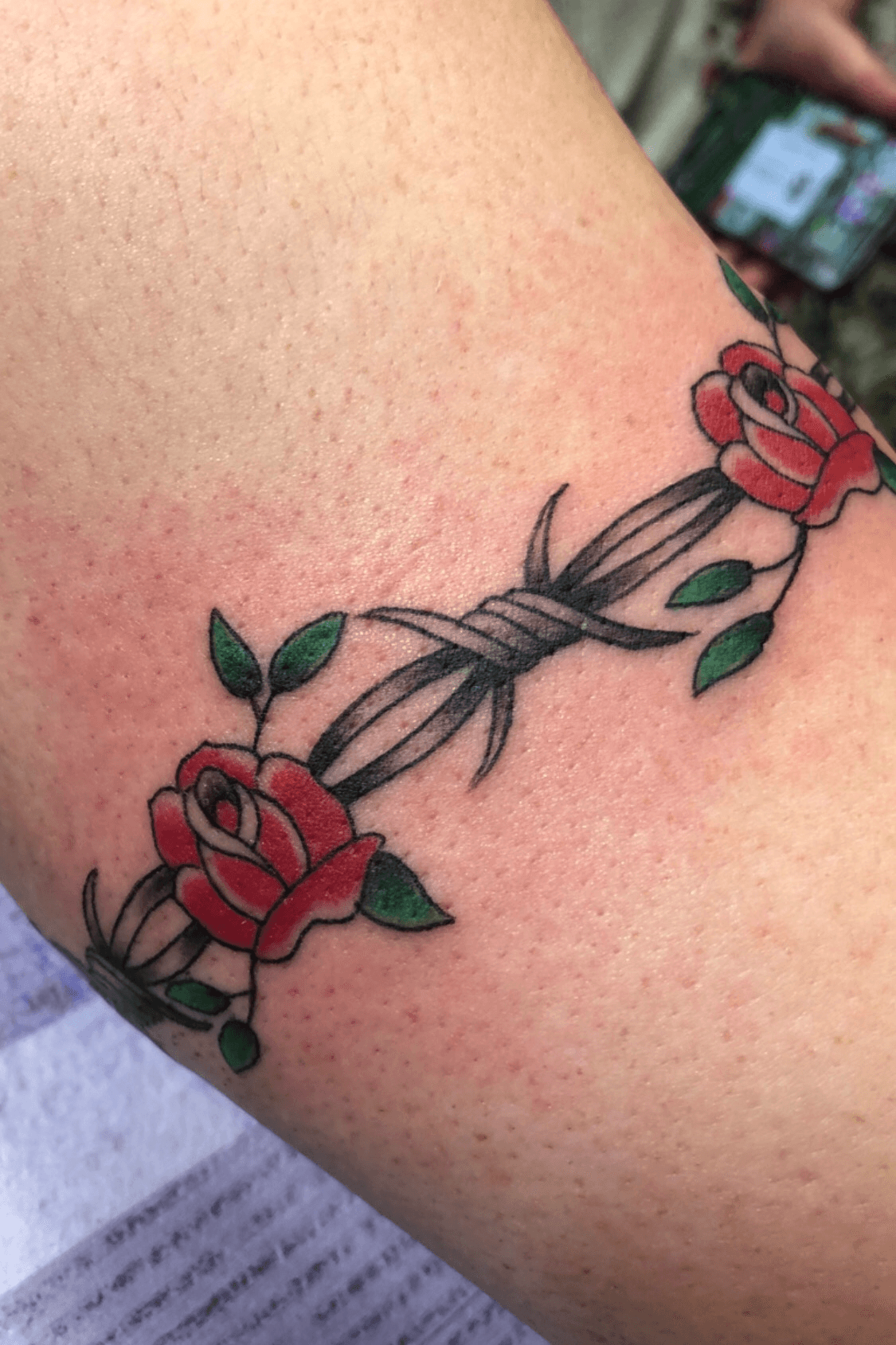 Tatoo of barb wire and roses