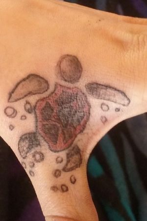 Cover up black heart with this red sea turtle done by Me Dizzy