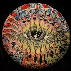 Biomech/ bio organic on a weird frisbee shaped canvas, I used ball point pen, colored pencils and a sharpie marker. 