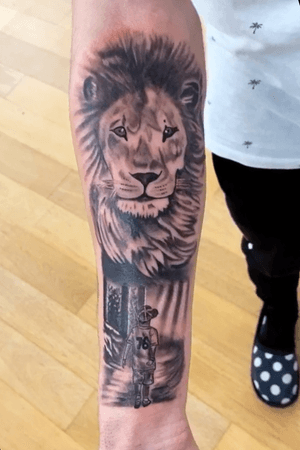 Lion fore arm tattoo