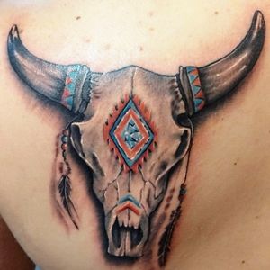 Realistic bull skull with traditional painting.