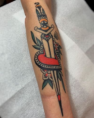 Dagger and heart tattoo by Imanol Lara #ImanolLara #traditional #dagger #heart #flower