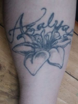 Flower was me and the lettering was done by a friend. Not to bad for my first tattoo 