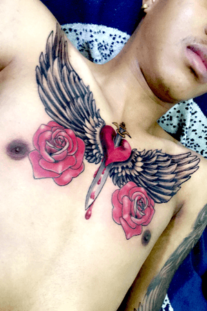 tattoo by @inktensean_tattoos #chestpiece #wings #roses #redroses #heart #heart&dagger #blooddrip #color #black&grey #cooltattoo