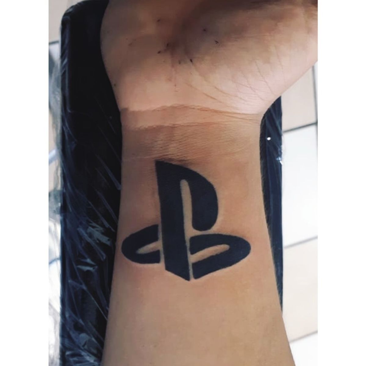 playstation symbol tattoo