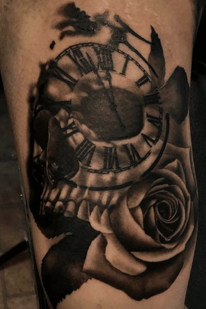 Skull with rose and Roman numerals.