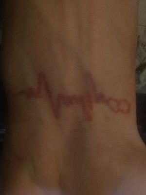 Heartbeat ECG tattooed by self. (Sheldon Eaton)