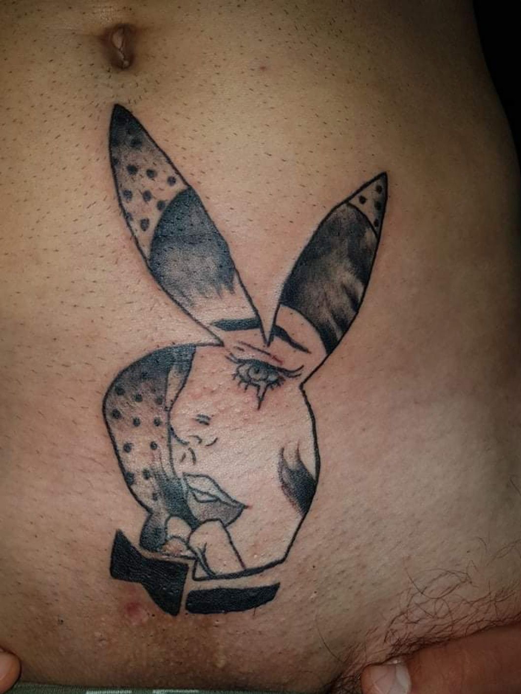Slideshow porn star with playboy bunny tattoo on small of back.