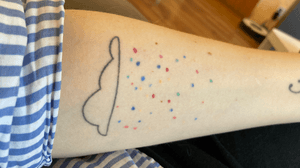 Cloud tattoo with raining candy