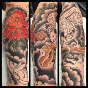 Traditional Japanese half sleeve of a eagle chasing a rabbit