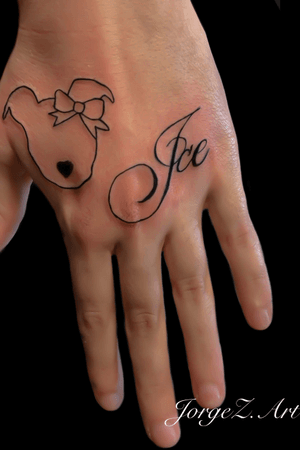 Dog and name hand tattoo