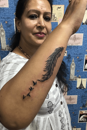 Feather with bird’s tattoo.sanjay jadav tattoo artist 