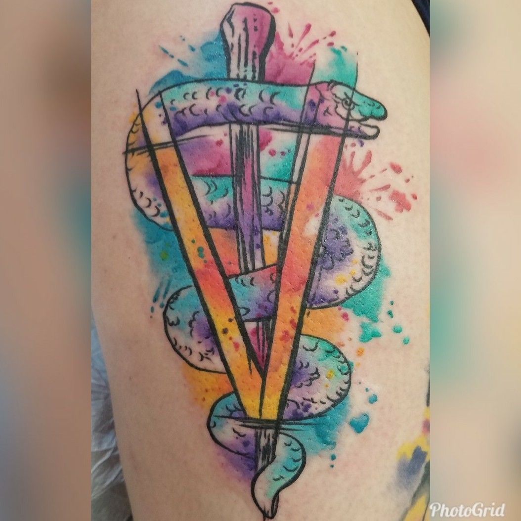 Tattoo uploaded by Gabriella Amodei • Watercolor Veterinary caduceus on the  side of my right thigh. • Tattoodo