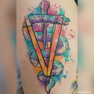Watercolor Veterinary caduceus on the side of my right thigh.