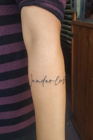 Wording arm band tattoo