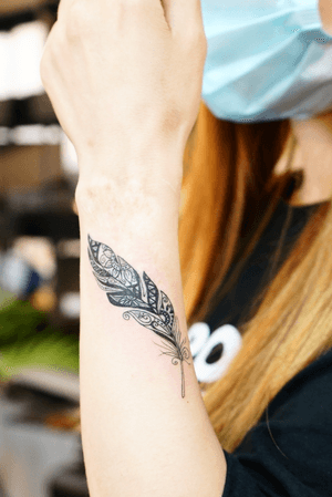 feather tattoo for woman