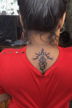 Sun with Trishul tattoo 