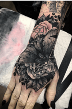 Hand tattoo by Nate Silverii aka hungryhearttattoos #NateSilverii #hungryhearttattos #handtattoo #moth #rose #flower #illustrative