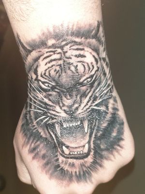 Tiger Face Hand Tattoo