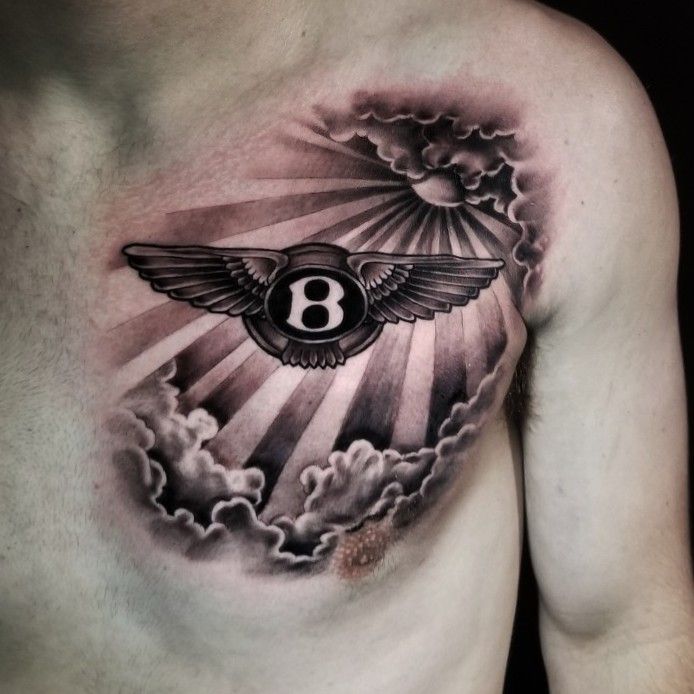 Awesome Bentley Logo Tattoo On Biceps By Angel Bustos