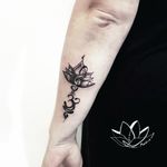 Forearm lotus with sol key & Sanskrit Breath Symbol custom tattoo