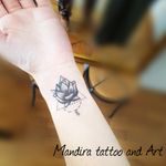 Lotus inner forearm cover tattoo