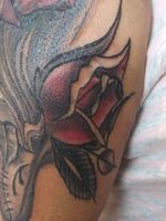 Rosebud tattoo by #crashmansontattoos