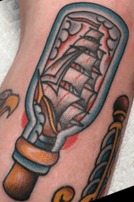 Old school traditional ship in a bottle by Joseph Fessman at Yellow Bord Tattoo in Richmond, VA.