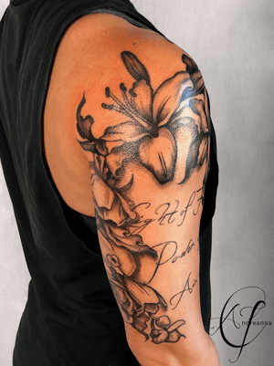 Black and grey floral cascade tattoo with lilies, roses, orchids and script by Andreanna Iakovidis #floral #lilies #roses #orchids #floralhalfsleeve #beautifultattoosforwomen #blackandgreyflorals