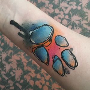 Tattoo of my dogs paw (he loves high fives) in water colour on my wrist