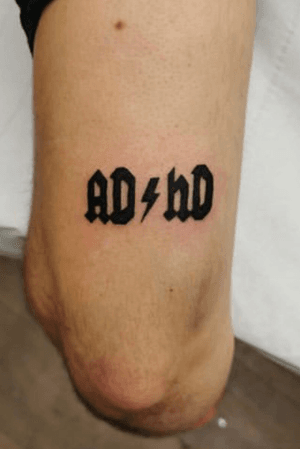 Express yourself with Jonathan Glick's stylish lettering tattoo on your upper arm.