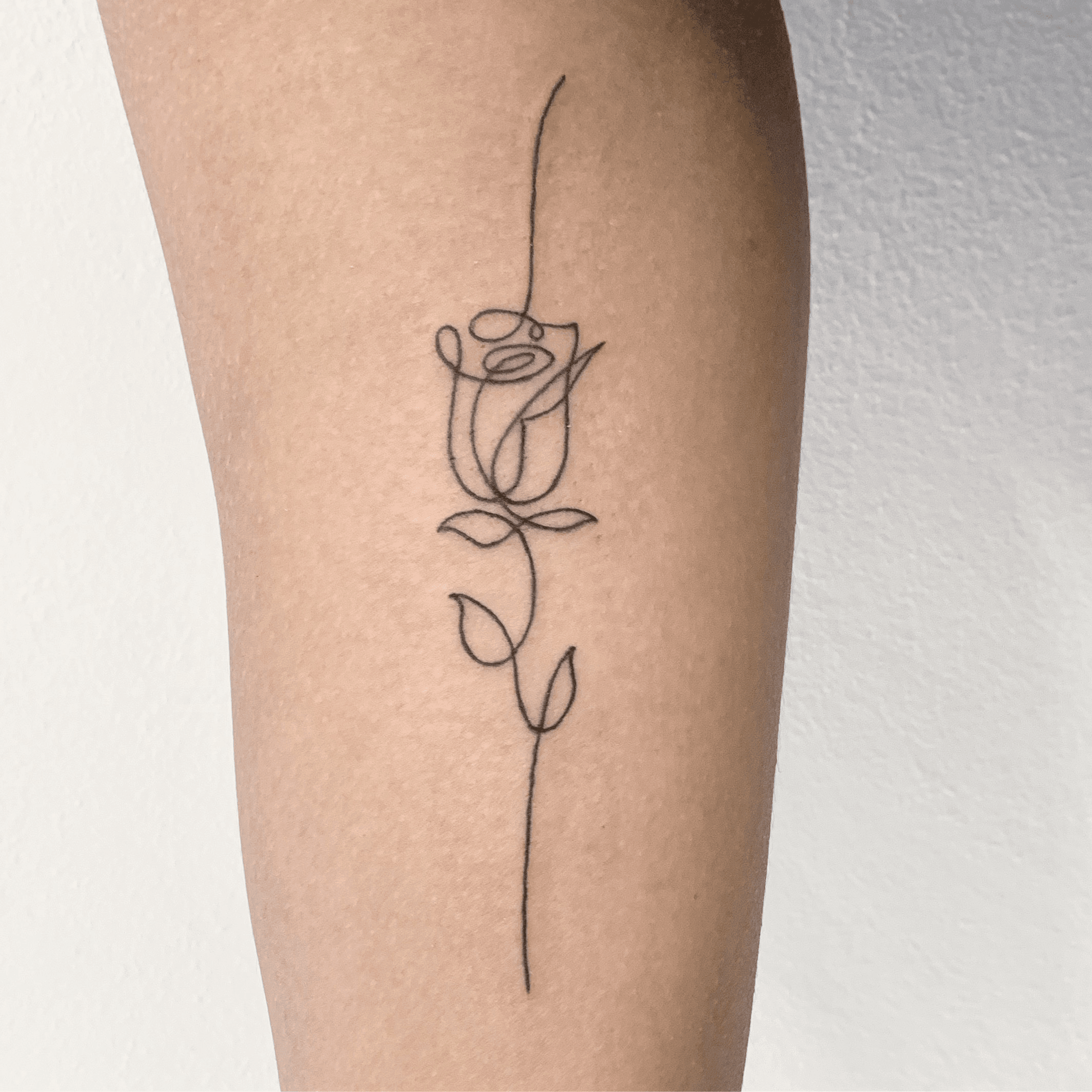 Tattoo uploaded by White Whale Amsterdam  Fine single line black rose on  the sternum  Tattoodo