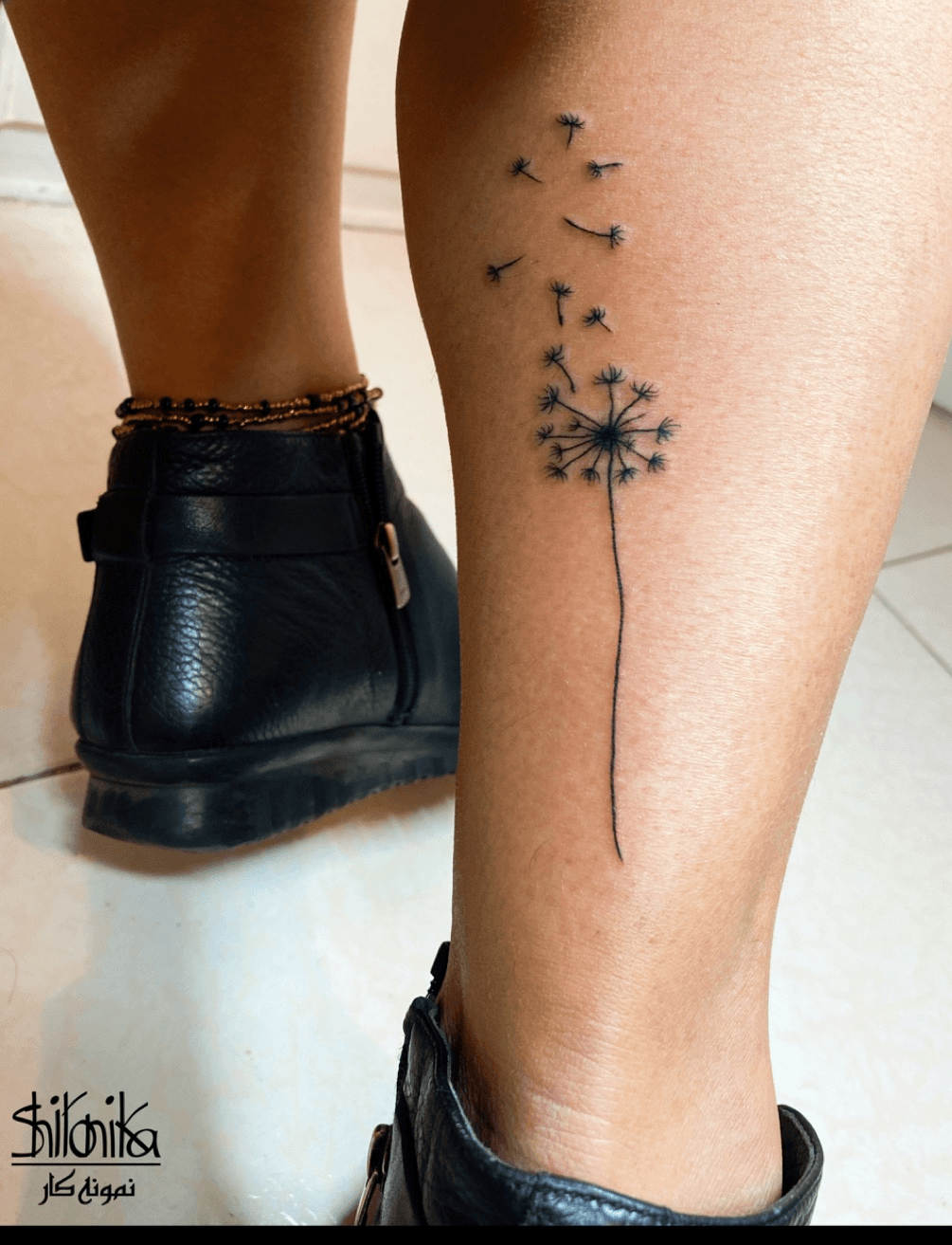 Fine line dandelion seeds tattoo on the ankle
