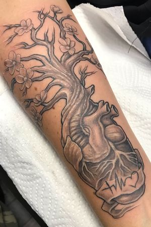 Black and grey heart morphed with a tree. Clients idea. Fun piece for first tattoo.