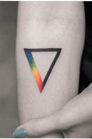 An upside down triangle with the LGBTQ+ flag down one side. 