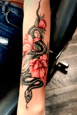Snake and flowers ornamental colour tattoo