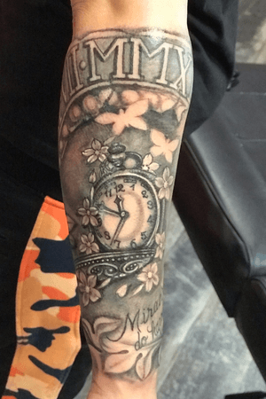 Blackandgrey forearm realistic tattoo