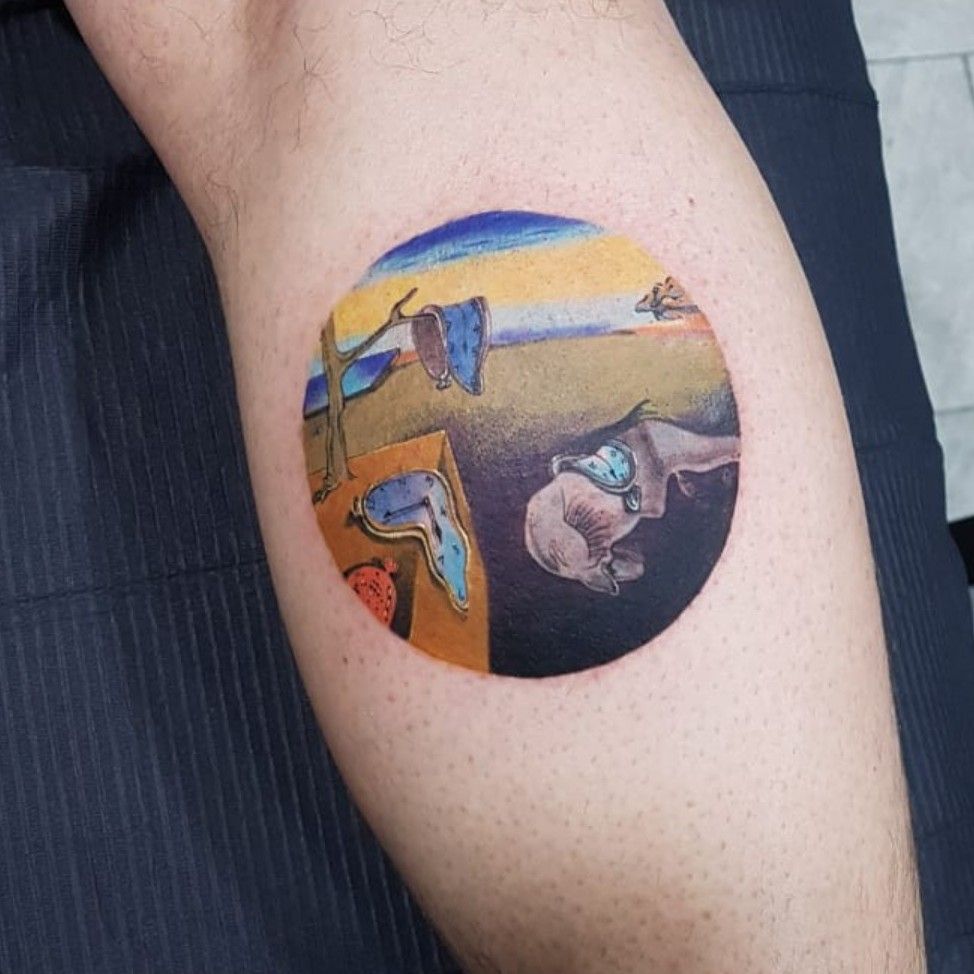 The persistence of Memory tattoo on the bicep