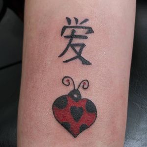 Oriental symbol for love and ladybug heart