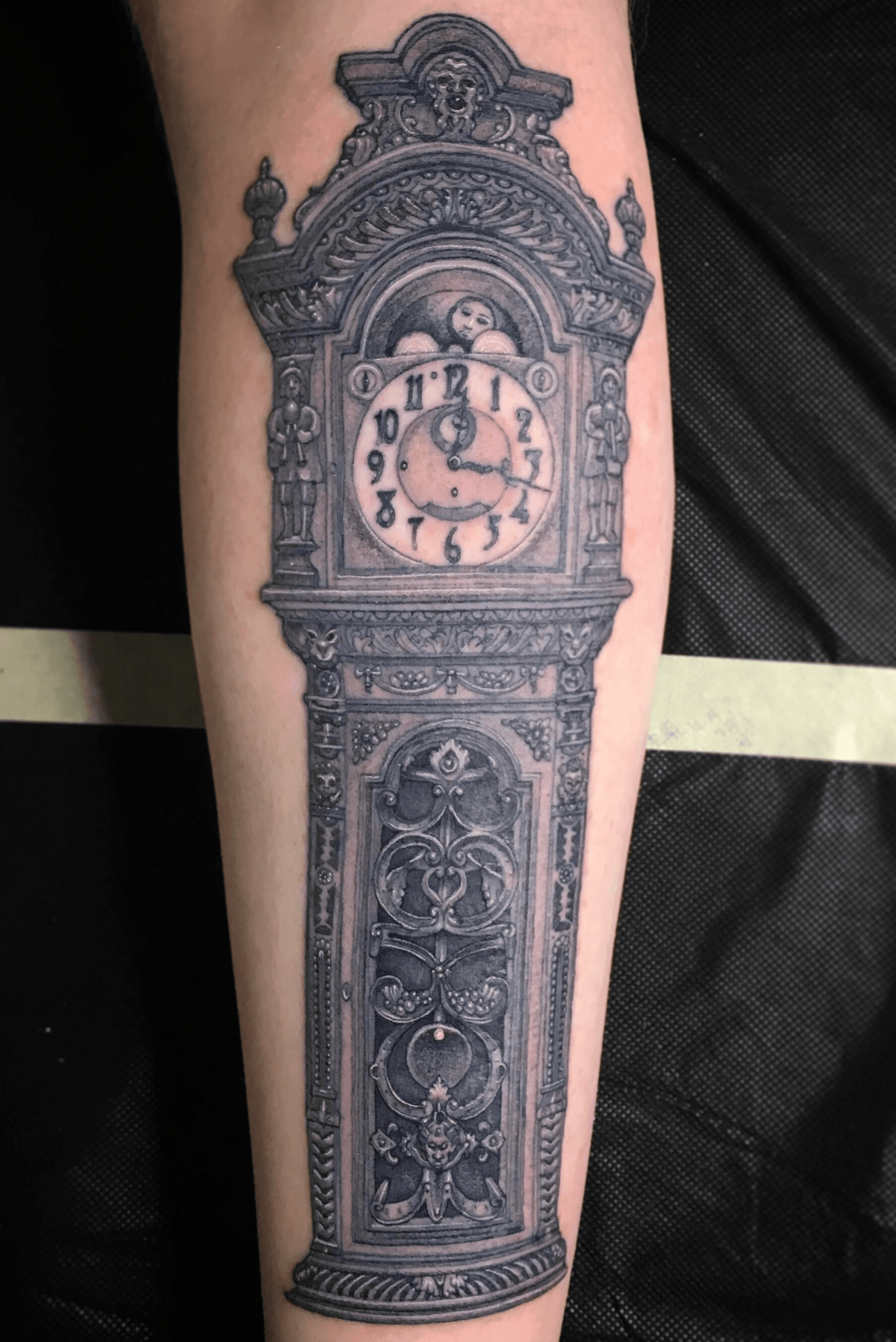 Spooky Grandfather Clock tattoo by Kelly Doty TattooNOW