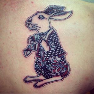 The March Hare (original artist unknown) tattooed by Mike Tattoos Crosby Liverpool UK. Part of a gradual back piece inspired by Alice In Wonderland. 