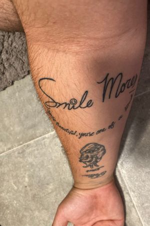 This tattoo is very meaningful to me be it’s from a YouTuber Romanatwood he would motivate me to smile more no matter what was going on and it really helped when I used to get bullied it would be the highlight of my day to come home to a new vlog that would make me forget about my problems for a while 