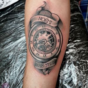 Clock tattoo for a father with his daughter's name and birthdate. 