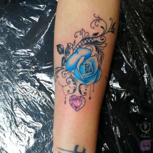 Blue rose tattoo with crystal heart and lace. 
