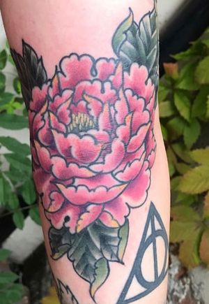 Peony on my left arm with a peek of deathly hallows. 
